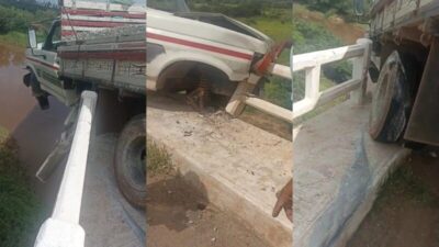 Caminhão fica pendurado em ponte na BR-316